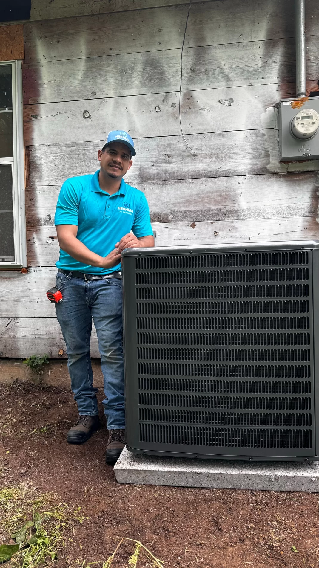 Heshma Air Conditioning technician preparing HVAC service equipment
